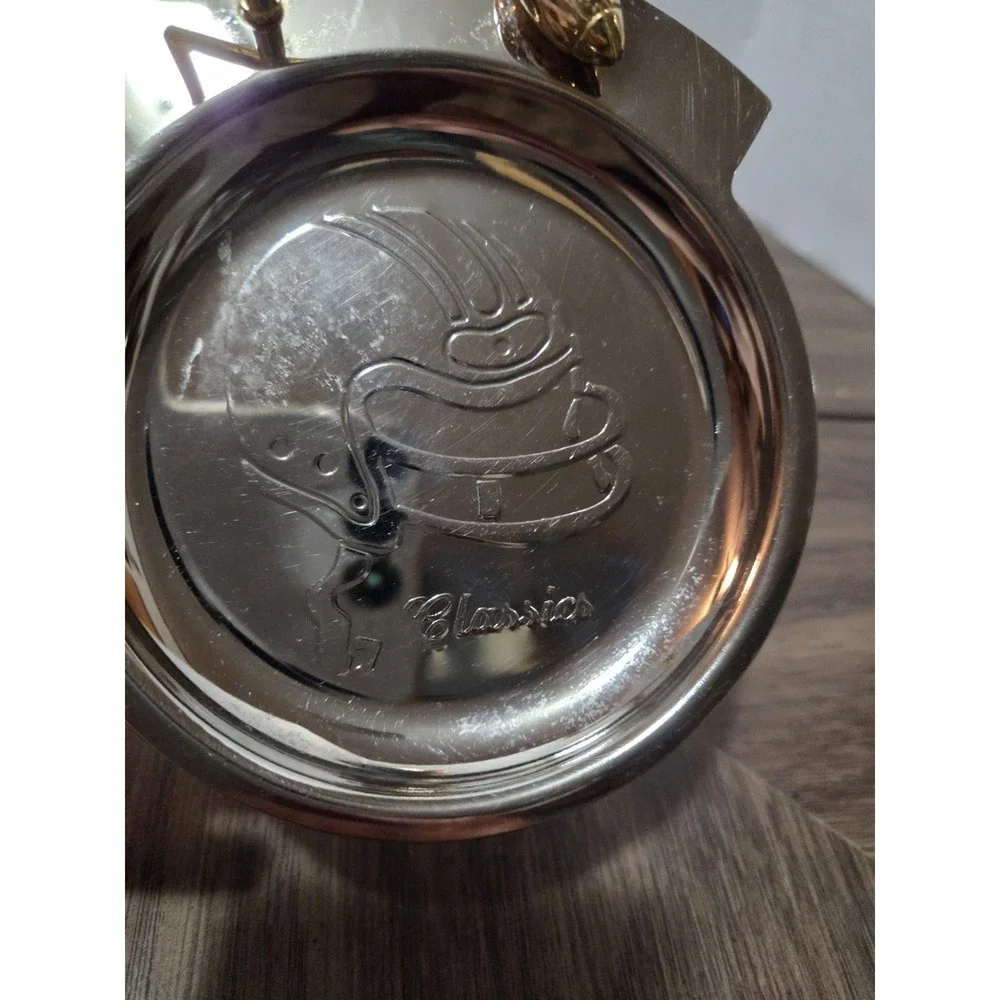 silver-tone and brass football 